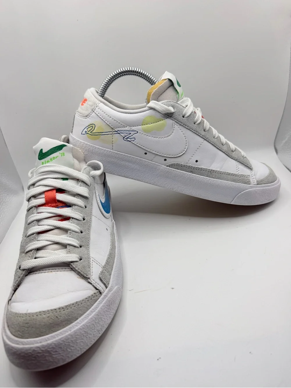 Nike White Low-Top Sneakers with Blue, Green, Yellow and Orange Accents
